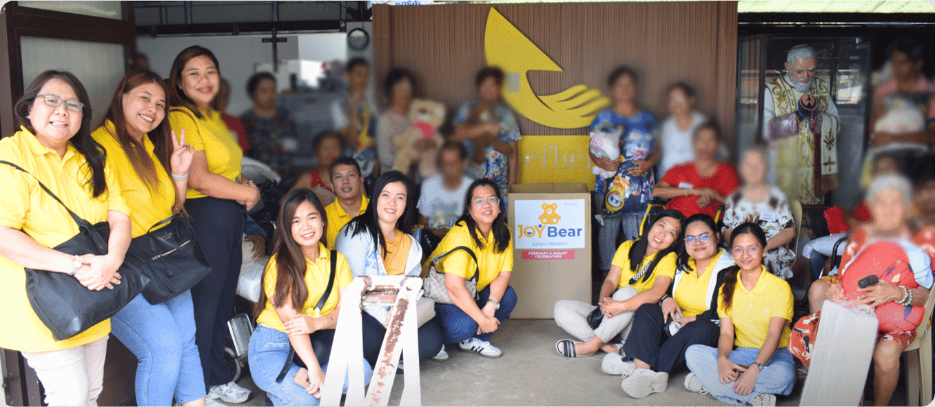 Joy~Nostalg volunteers gathered during a community visit